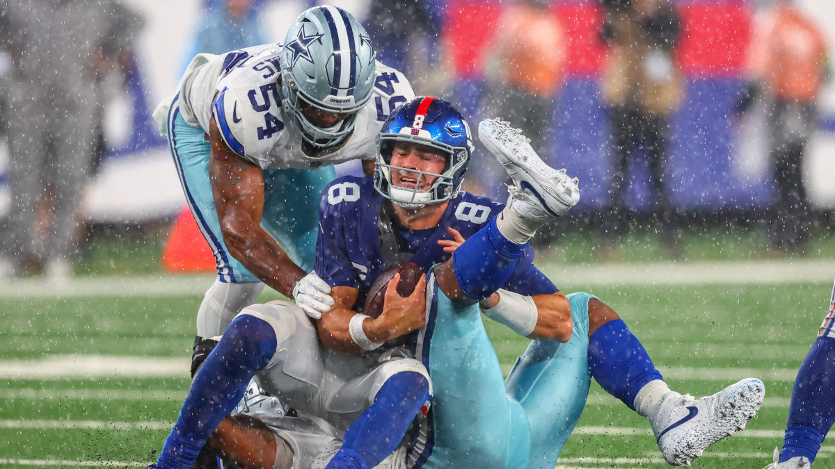 Daniel Jones is sacked by two Cowboys defenders